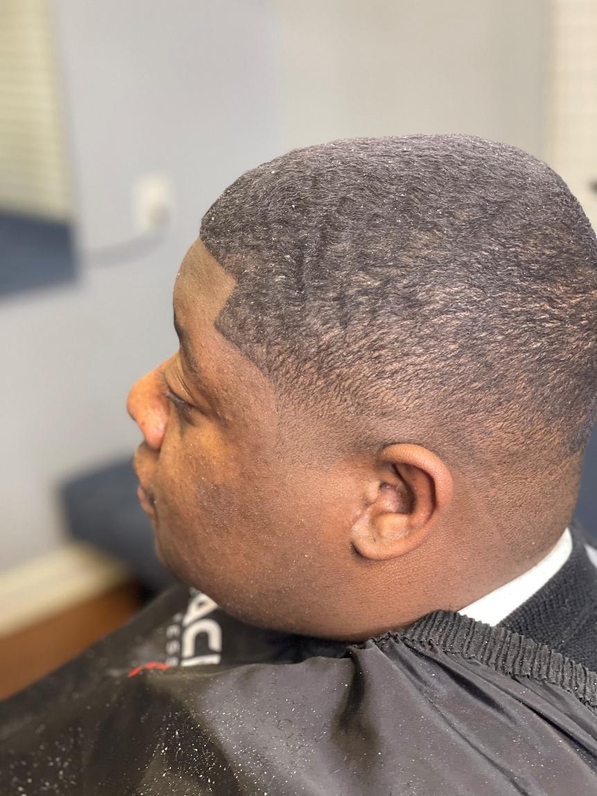 A fresh clipper shave paired with waves, demonstrating the balanced, natural finish clients appreciate when choosing clippers over traditional razor shaves